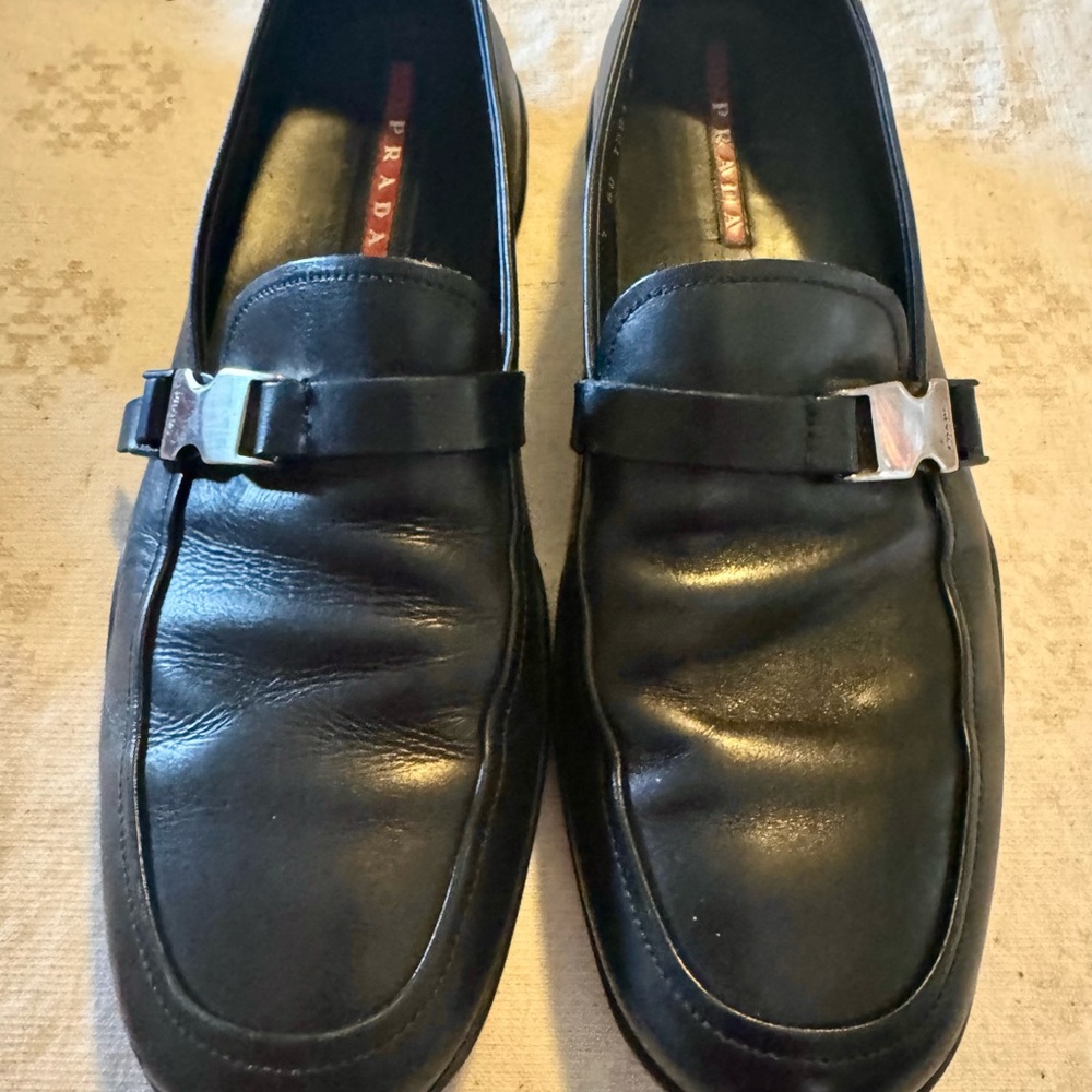 Prada Black Leather Slip-On Loafers with Silver Buckle